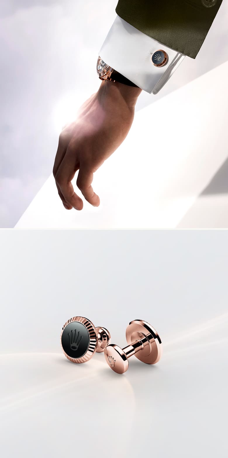 Rolex Accessories: Two images of Rolex 'Fluted' cufflinks in Everose gold, shown modelled on a sleeve on top and in close-up view below. - DAFC