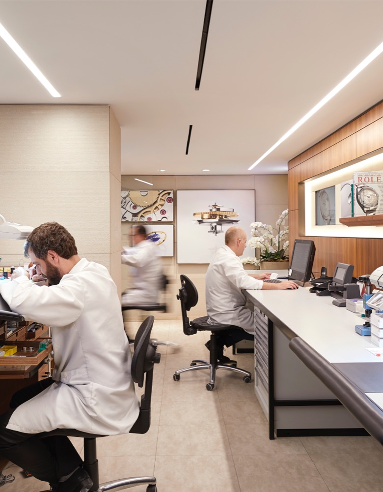 Watchmakers at work in a Rolex Authorised Service Centre.