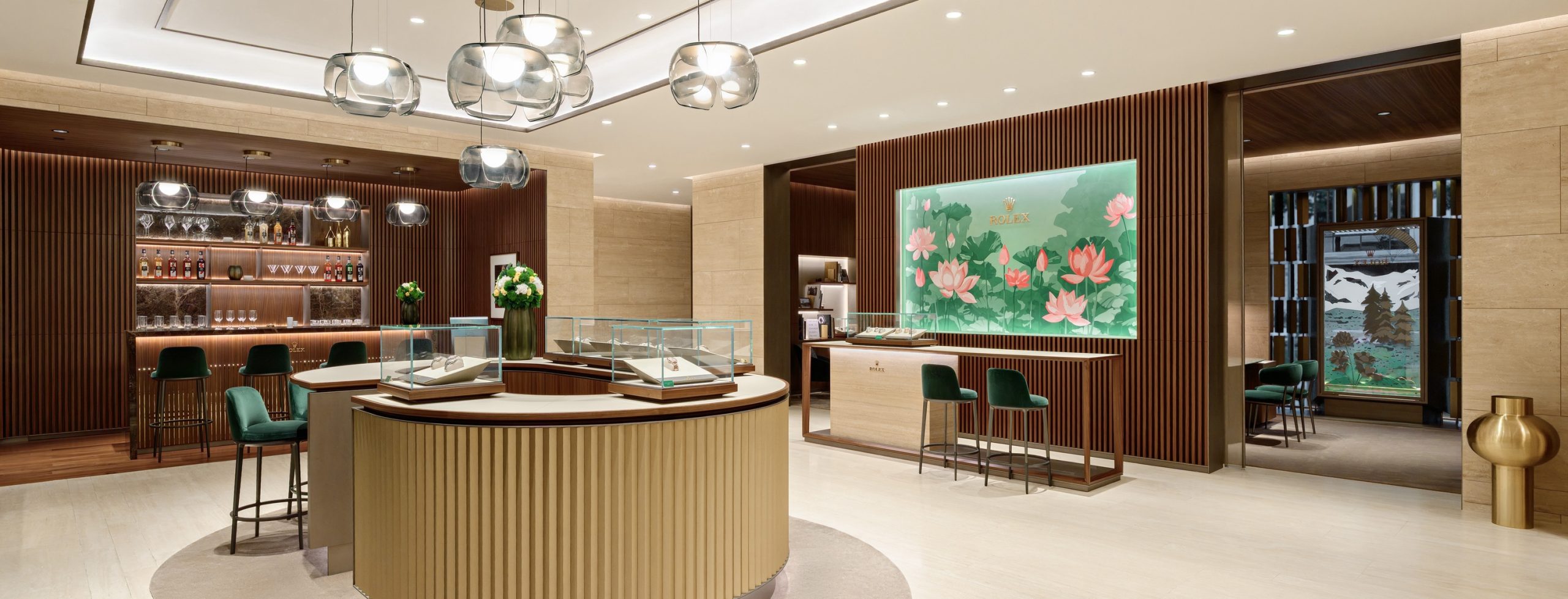 Interior of DAFC Rolex boutique in Vietnam with elegant glass display cases, wooden slatted walls, crystal pendant lights, and luxury watches showcased under warm lighting.