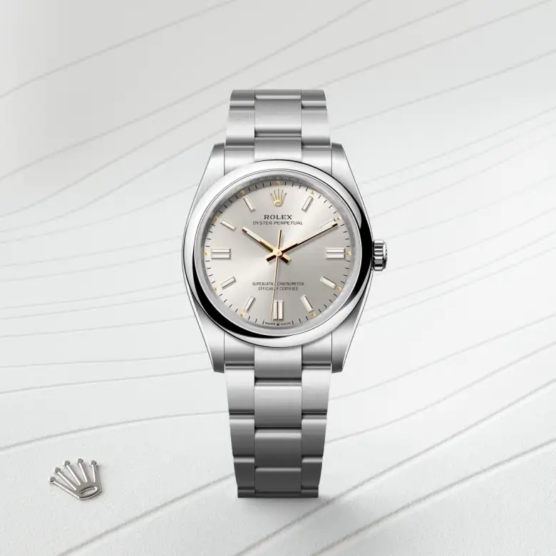The Rolex Oyster Perpetual 36 in Oystersteel shown against a muted elegant background.