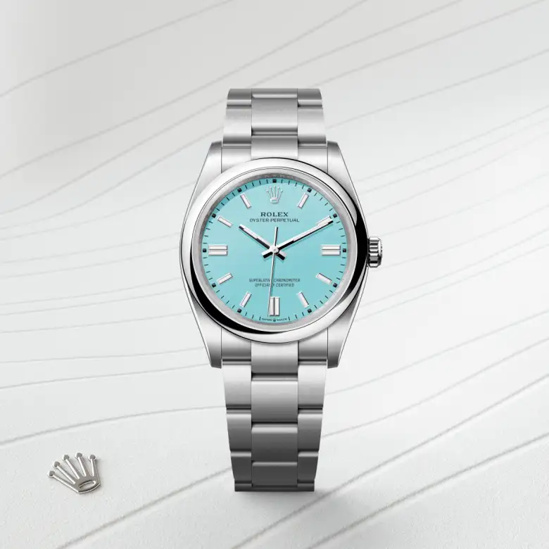 The Rolex Oyster Perpetual 36 in Oystersteel shown against a muted elegant background.