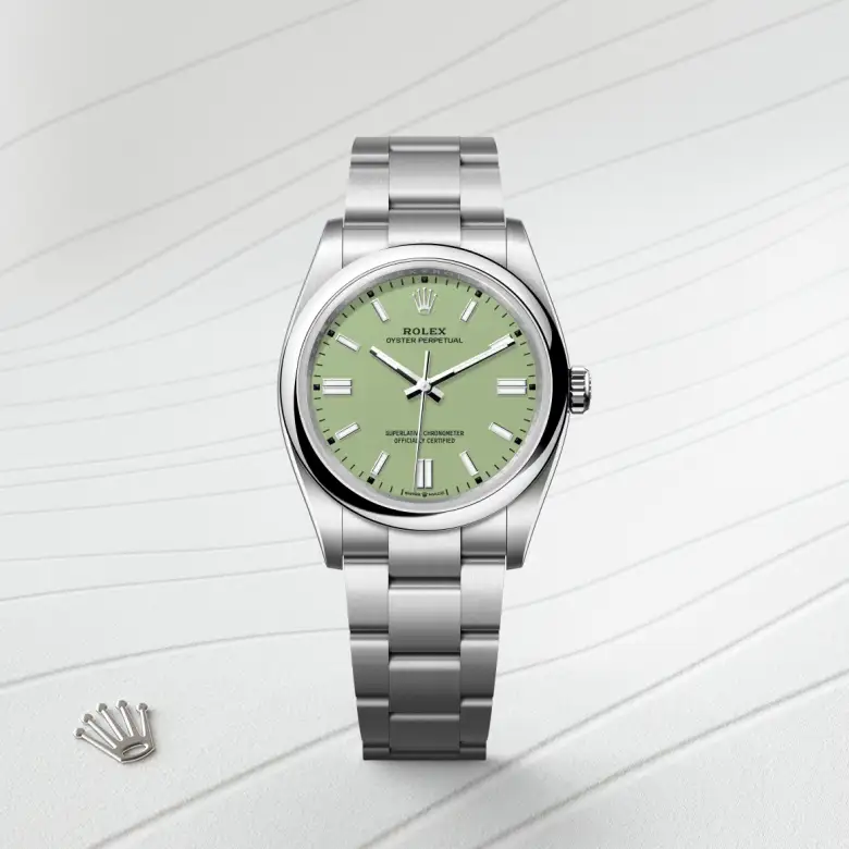 The Rolex Oyster Perpetual 36 in Oystersteel shown against a muted elegant background.