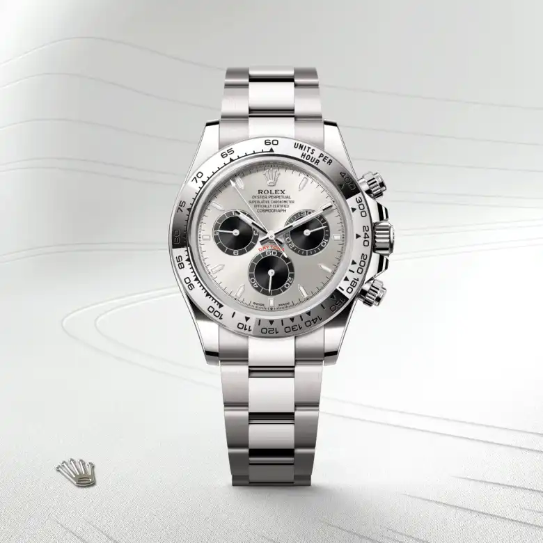The Rolex Cosmograph Daytona in white gold shown against a muted elegant background.
