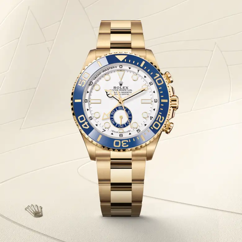 The Rolex Yacht-Master II in yellow gold shown against a muted elegant background.