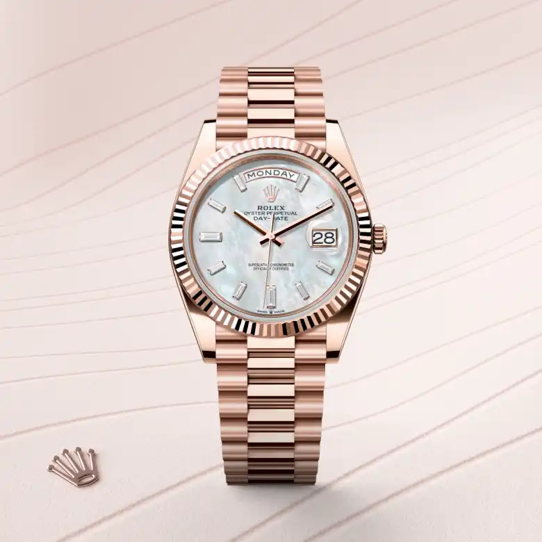 The Rolex Day-Date 40 in Everose gold shown against a muted elegant background.