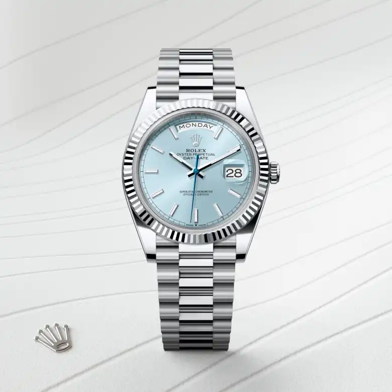 The Rolex Day-Date 40 in platinum shown against a muted elegant background.