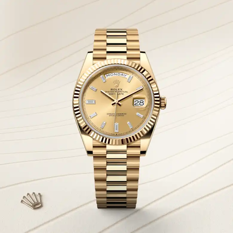 The Rolex Day-Date 40 in yellow gold shown against a muted elegant background.