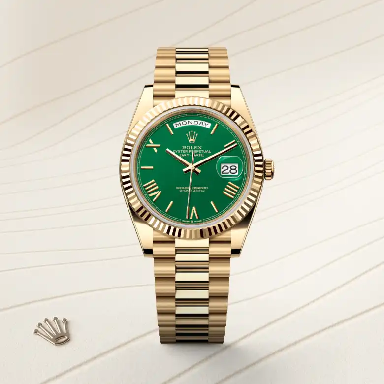 The Rolex Day-Date 40 in yellow gold shown against a muted elegant background.