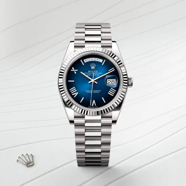 The Rolex Day-Date 40 in white gold shown against a muted elegant background.