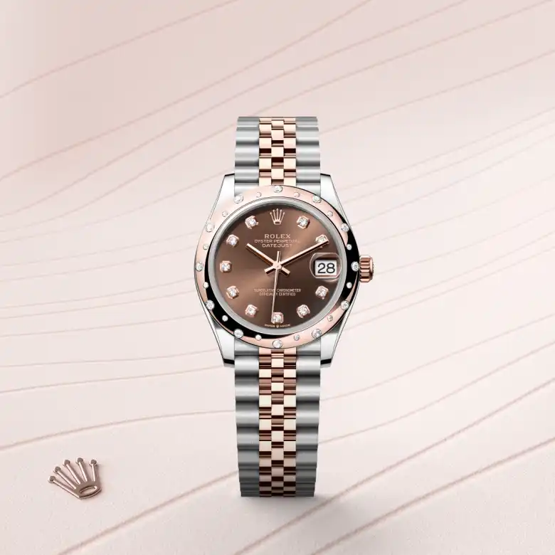 The Rolex Datejust 31 in Oystersteel, Everose gold and diamonds shown against a muted elegant background.