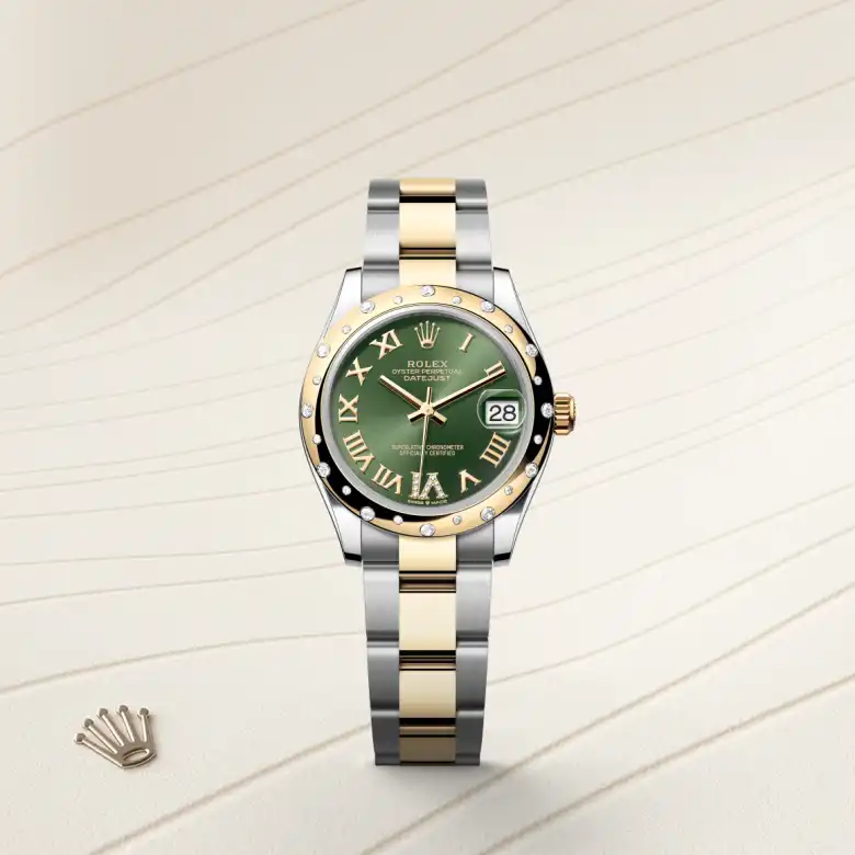 The Rolex Datejust 31 in Oystersteel, yellow gold and diamonds shown against a muted elegant background.