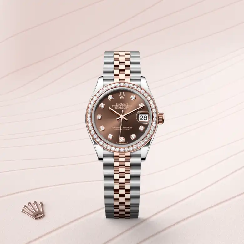 The Rolex Datejust 31 in Oystersteel, Everose gold and diamonds shown against a muted elegant background.