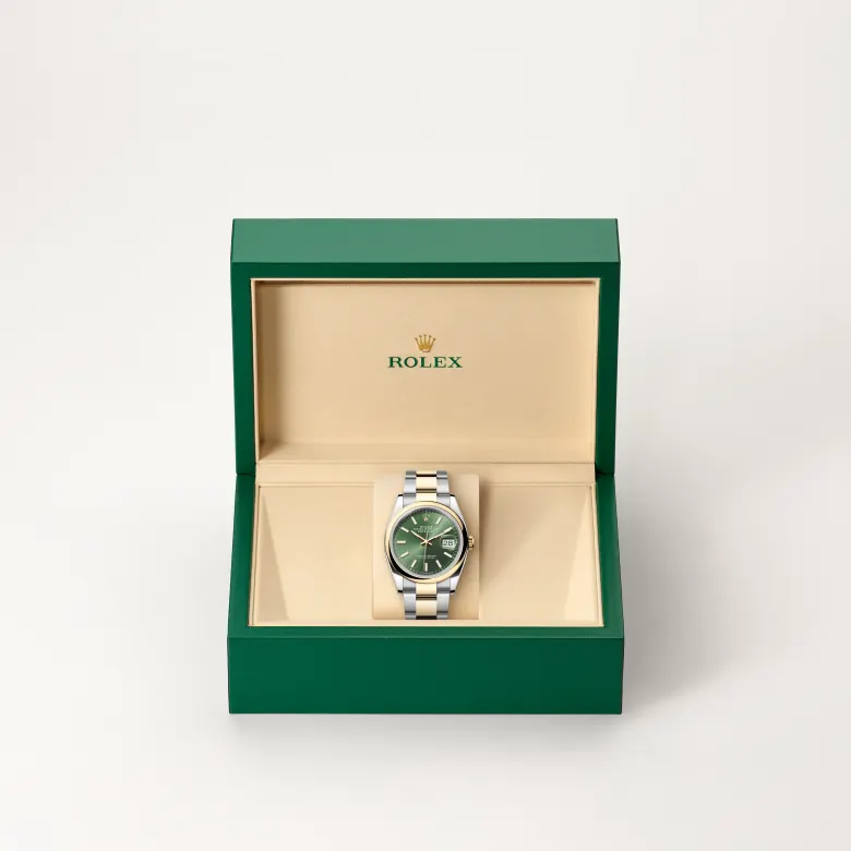 The Rolex Datejust 36 in Oystersteel and yellow gold in the Rolex presentation box.