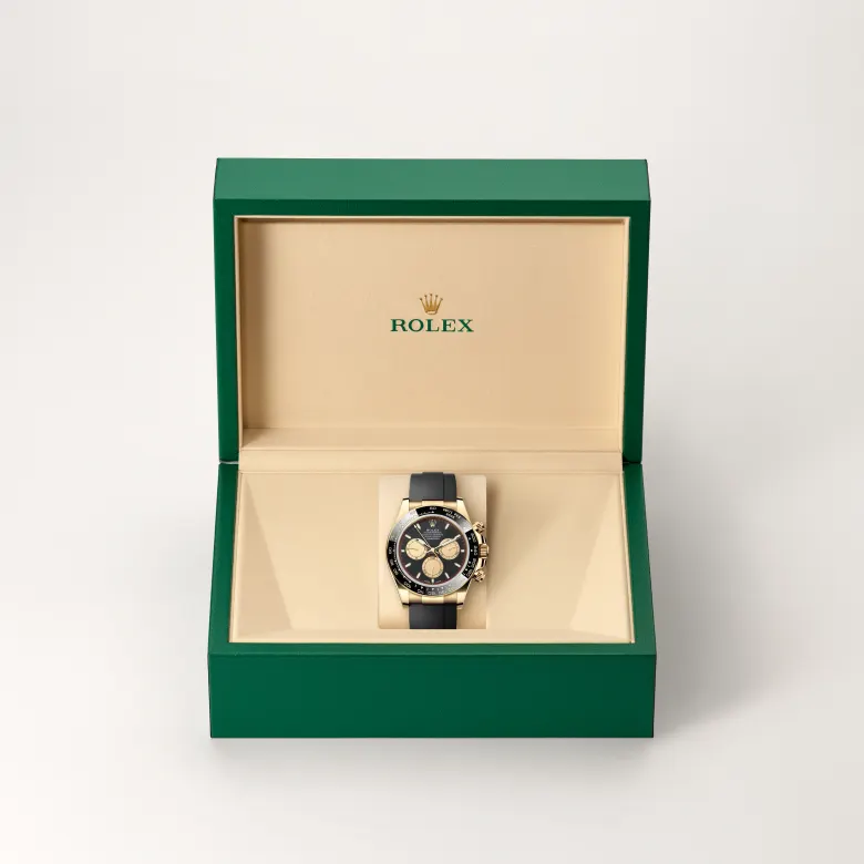 The Rolex Cosmograph Daytona in yellow gold in the Rolex presentation box.