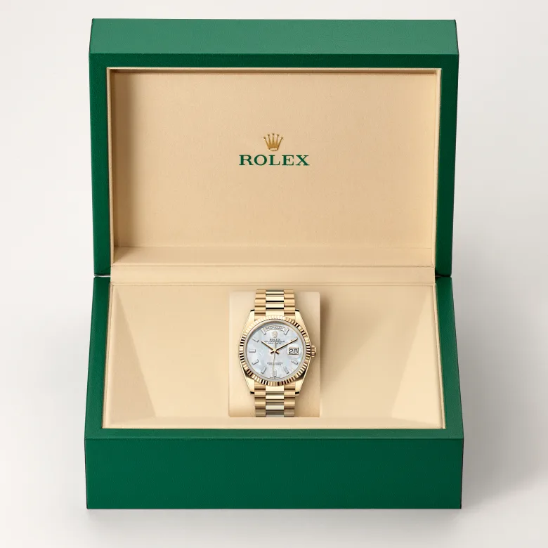 The Rolex Day-Date 36 in yellow gold in the Rolex presentation box.