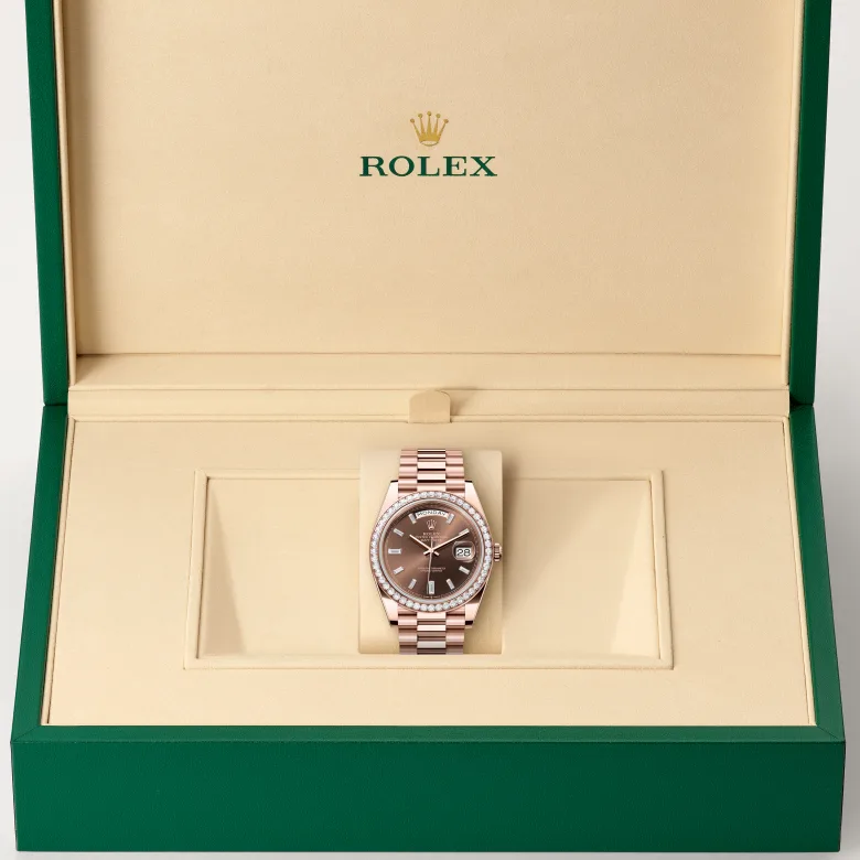 The Rolex Day-Date 40 in Everose gold and diamonds in the Rolex presentation box.