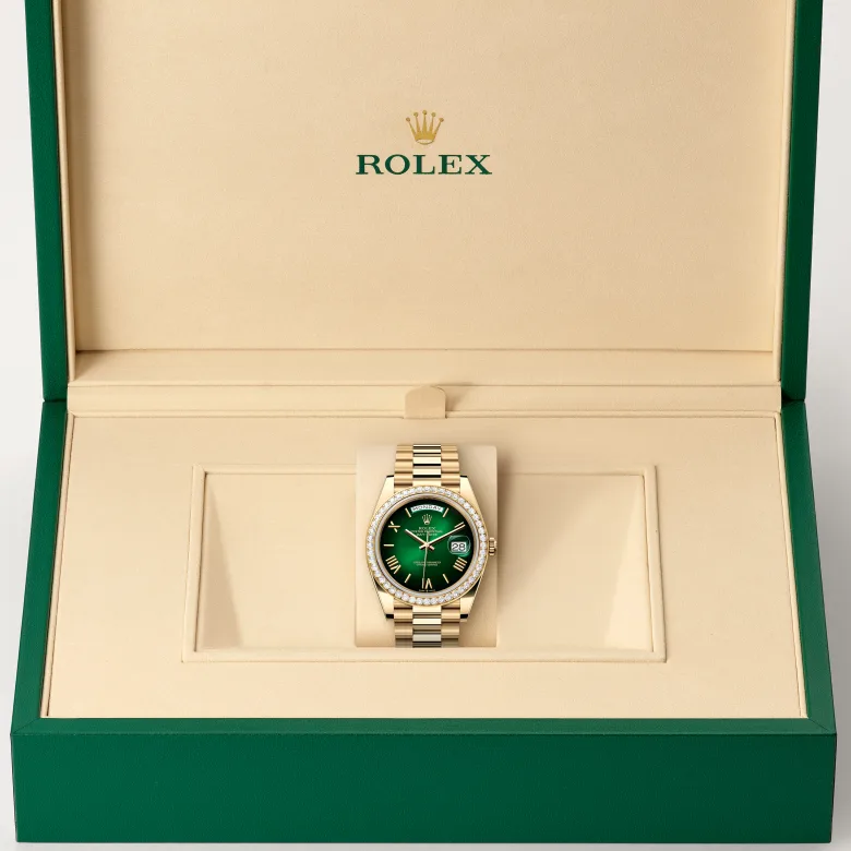 The Rolex Day-Date 40 in yellow gold and diamonds in the Rolex presentation box.