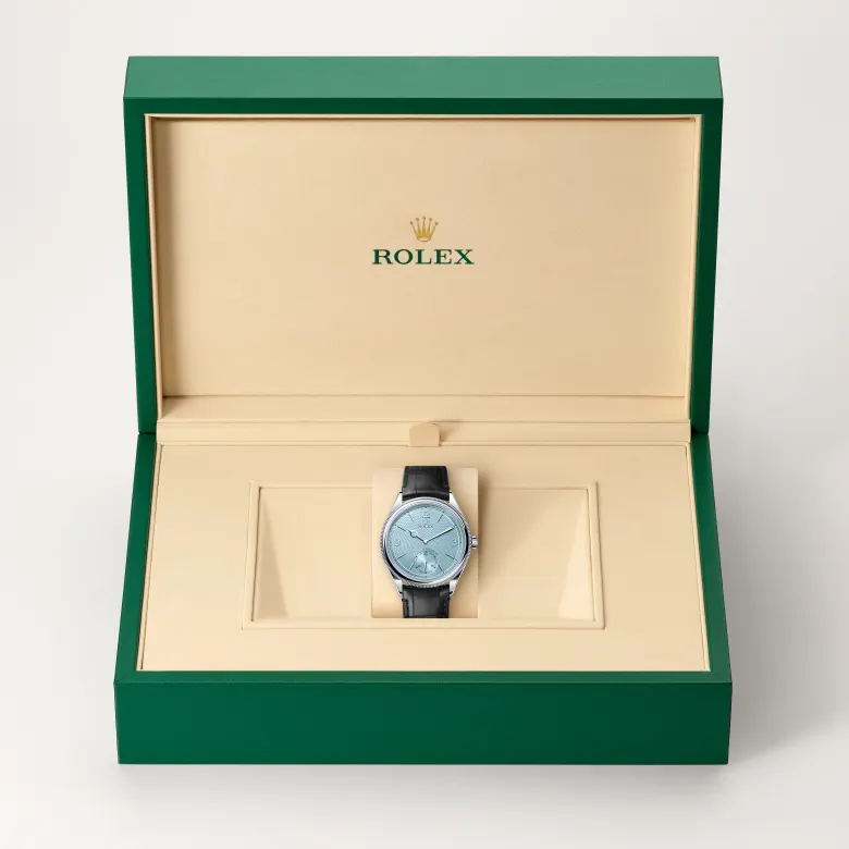 The Rolex 1908 in platinum, polished finish in the Rolex presentation box.